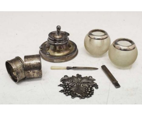 Quantity of silver items to include George V silver inkwell, Birmingham 1915, plated Claret label, silver-mounted match strik