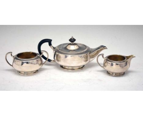 George V 'bachelor's' silver three-piece tea set, London 1916/Sheffield 1917, teapot 10cm high, 755 grams approx gross