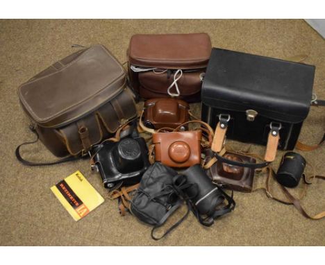Quantity of vintage cameras and accessories, to include lenses, carry cases, Kodak camera, etc