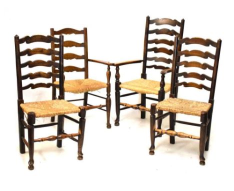 Three rush seated ladder back dining chairs (2 + 1) and another ladder back chair with arms (4)