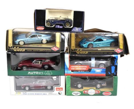 Seven boxed 1/18 scale diecast model vehicles comprising; Guiloy, Kyosho, Auto Art, Sun Star, Britains &amp; James Bond 007 4