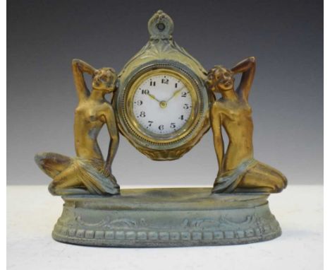 Art Deco spelter figural clock having a white Arabic dial with gilt hands, 17cm x 17cm high