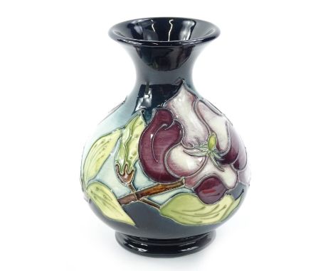 A Moorcroft Magnolia pattern vase, designed by Walter Moorcroft, the tube lining by Catherine Beech and paintress Sylvia Abel