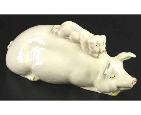 A Beswick ceramic pig group, modelled in the form of a sow with a piglet on her back, 16cm W.