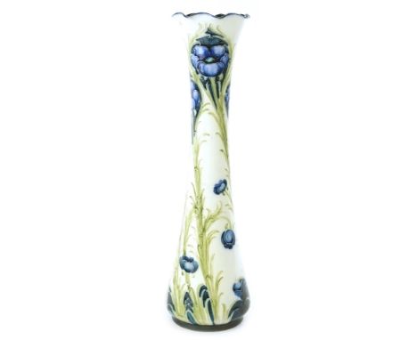 A MacIntyre &amp; Co Moorcroft Florian ware vase, decorated with a poppy design, in blue and green, on a cream ground, the wa