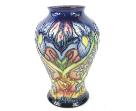 A Moorcroft Gentian pattern trial vase, decorated with flowers, leaves etc. on a mottled blue ground, designed by Philip Gibs