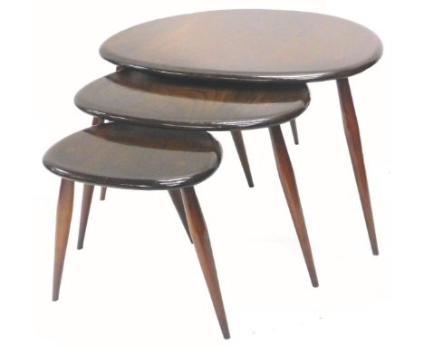 A nest of three Ercol pebble shaped tables, each on turned tapering legs, the largest, 64cm W, adapted, 134cm W.