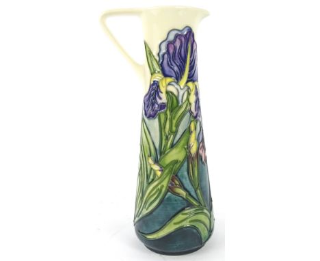 A Moorcroft Iris pattern ewer, decorated with flowers and leaves on a mottled cream and blue ground, designed by Rachel Bisho