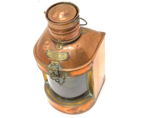 A copper and brass ships lantern labelled Stern, with paraffin lamp to the interior, 41cm H.