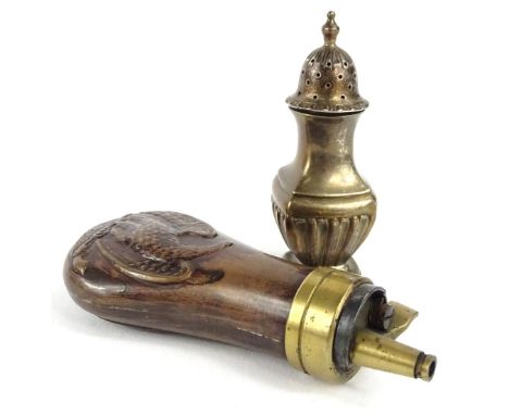 A copper and brass shot flask, decorated with an American eagle and a silver pepper pot with part fluted decoration. (2)