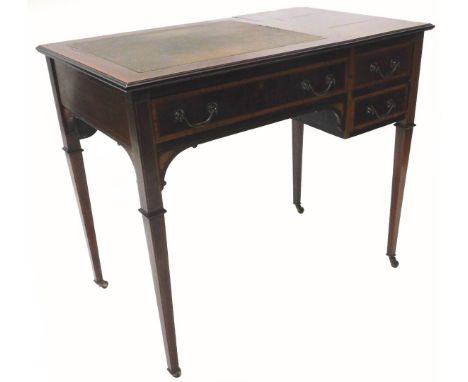 An Edwardian mahogany and satinwood cross banded writing table, the top with a brown leather inset, flanked by a hinged compa