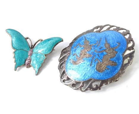 Two silver and enamel brooches, to include a silver and blue and purple enamel butterfly brooch, an oval silver and enamel br