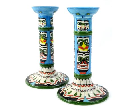 A pair of Moorcroft tribal range candlesticks, designed by Jackie Rowe, with tube lining by Kerry Marshall and the paintress 