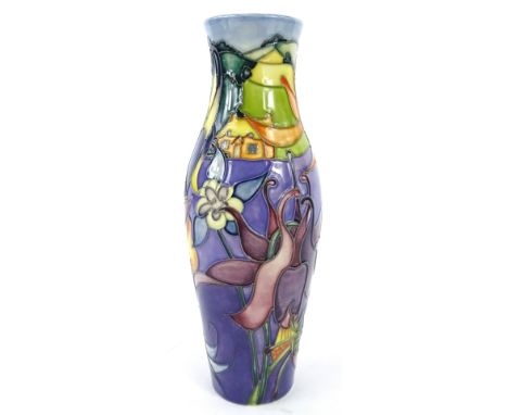 A Moorcroft Lavenham pattern vase, decorated with flowers, cottage etc. on a mottled purple ground, designed by Jeanne McDoug