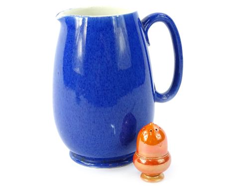 Two items of Moorcroft ceramics, a powder blue jug, indistinct impressed mark to underside and an acorn shaped orange lustre 