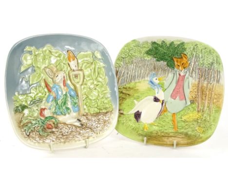 A pair of Beswick plates, each relief moulded and decorated with scenes from Beatrix Potter, first edition and second edition