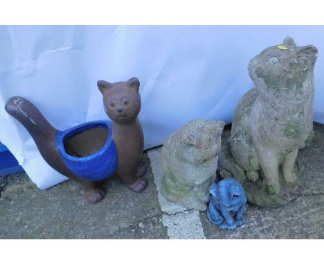 A collection of garden cat ornaments, to include an example with a central planter, and a large cat previously painted, 47cm 