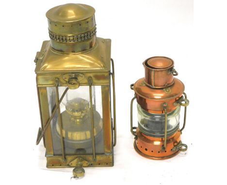 A brass ship's type lantern, of rectangular form, with a cylindrical pierced cowl and oil lamp to the interior, 37cm H and a 