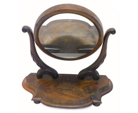 A Victorian mahogany swing frame dressing table mirror, on shaped supports with serpentine moulded base with bun feet, 70cm W