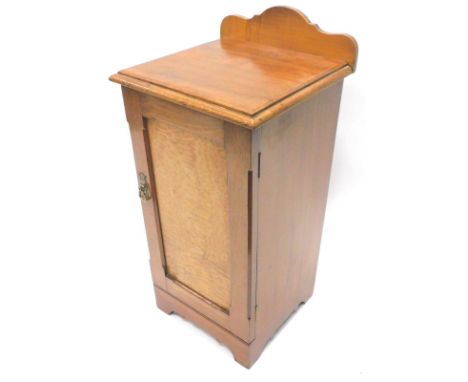 A Victorian walnut and Hungarian ash pot cupboard, with a raised back and a panelled door on bracket feet, 37.5cm W.