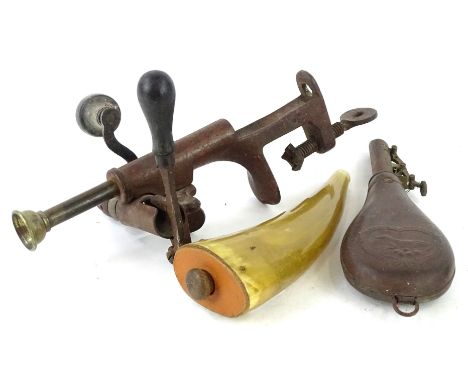 A gun cartridge loading device, with clamp, etc., a leather and copper shot flask, moulded with a dog, a horn flask. (3)