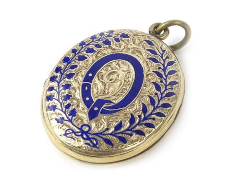 A Victorian locket, with floral etched design, raised front with leaf scroll, blue enamel borders, and central Q motif, inscr