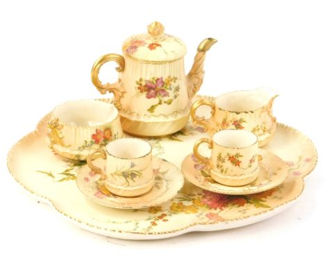 A Royal Worcester porcelain Cabaret tea set, comprising of a shaped tray, teapot and cover, sugar bowl, milk jug, two cups an