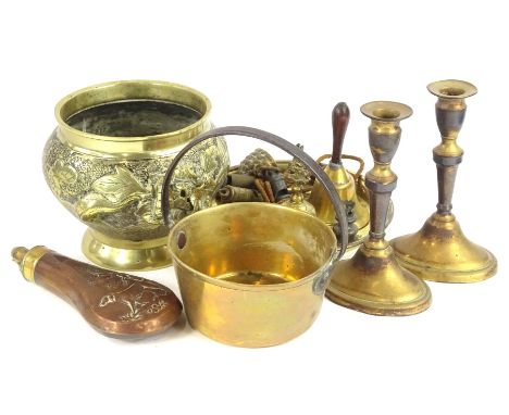 A collection of metalware, to include a powder flask cast with a hunting dog, pair of candlesticks, oriental jardiniere, smal