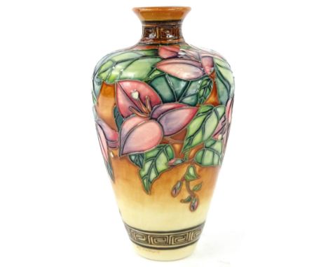 A Moorcroft Bougainvillea pattern vase, decorated with flowers and leaves on a mottled orange ground, designed by Anji Davenp