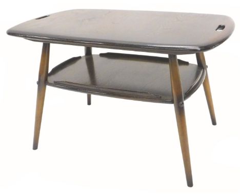 An Ercol two tier coffee table, with carrying handles, the undertier with gallery on turned tapering legs, 72cm W.