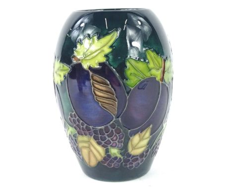 A Moorcroft vase, decorated with plums and blackberries on a dark green ground, designed by Rachel Bishop, T mark and impress