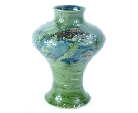 A Moorcroft pottery Claremont pattern vase, decorated overall with mushrooms in green, on a mottled blue ground, hand scripte