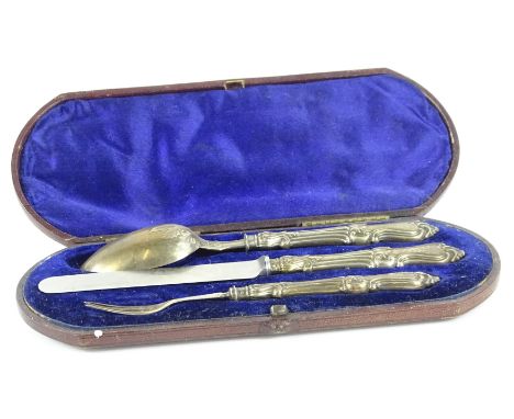 A Victorian silver mounted three piece christening set, comprising spoon, fork and knife, Chester 1871, in a fitted case.