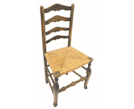 An early 19thC country made ladder back side chair, with a later rushed seat, on cabriole legs with turned stretchers.
