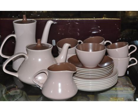 A Poole brown two-tone tea service, comprising teapot, water jug, milk jug, sugar bowl, six cups and saucers, and six cake pl