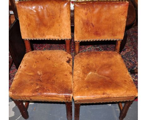 A set of six 1920's oak dining chairs with original brown leather and brass stud upholstery, by T.Knight & Son of Bath (6)