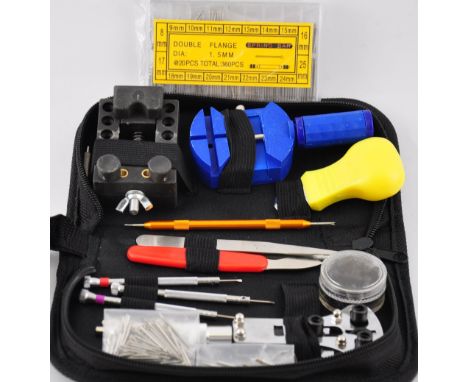 A complete set of watchmaker's tools including appox. 400 strap pins