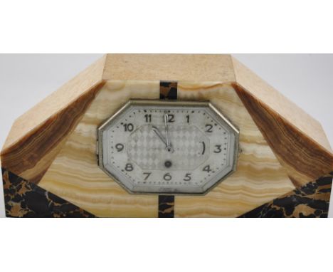 An eight day French mantle clock the octagonal face with arabic numerals set in a marble surround
