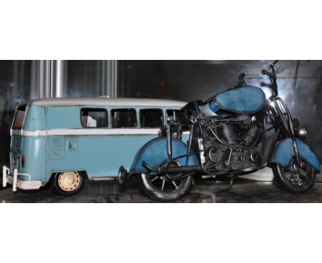 A vintage style tin plate model of a camper van, together with a similar model of a motorcycle