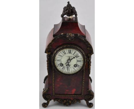 A late 19th Century gilt brass and red tortoiseshell 8 day mantel clock, the circular white enamel dial marked arabic and rom