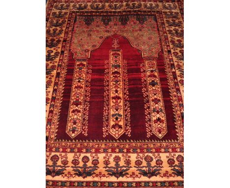 A Belgian machine made Samarkand red ground wool carpet, 191 x 136cm