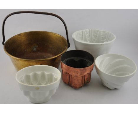 Three ceramic jelly moulds, a similar example and a copper pan with handle
