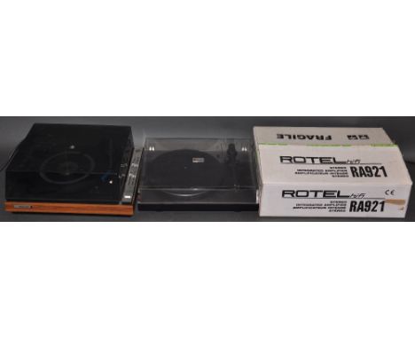 A Pro-Ject Debut II turntable together with a Ferguson model 3047  turntable and a Rotel RA921 amplifier 