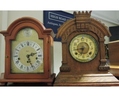 An early 20th Century American Ansonia oak cased mantel clock together with a modern Georgian design mantel clock 