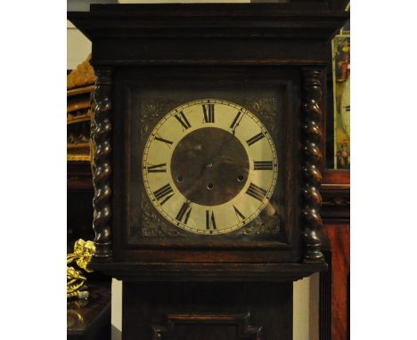 A 1920s oak eight day striking 3 train Grandfather clock, with barley twist columns to hood 