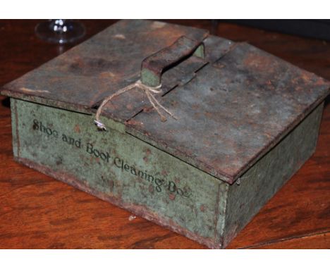 A vintage tin plate shoe shine box