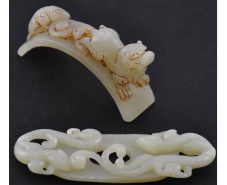 A Chinese jade carving in the form of two beasts, together with a similar jade pendant