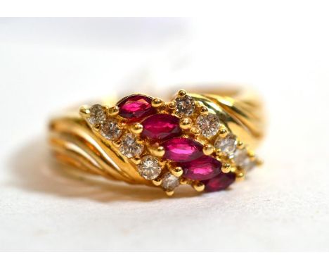 A diamond and ruby ring, stamped '14K', finger size M.  Gross weight - 4.29 grams. 
