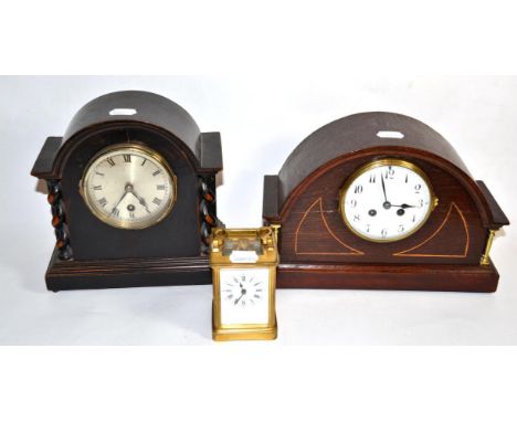 A French brass cased carriage clock; and two Edwardian mantel clocks, one with French cylinder movement 
