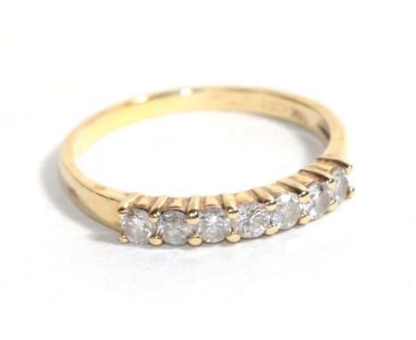 A diamond half hoop ring, the round brilliant cut diamonds in yellow claws to a plain polished shank, total estimated diamond